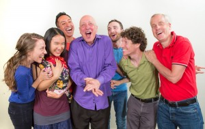 Pictured L to R: Miriam Ani as Qarak, Heather Nguyen as Annie, David Zubiria as Ryan, Michael DeMartini as Neely, Devin Goodman as DelMonico, Gabriel Ross as Seano and John Fisher as Johno in DAREBNB by John Fisher; a Theatre Rhinoceros/SparkArts production at SparkArts. Photo by David Wilson.