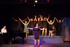 Pictured L to R: Justin Genna* as Peter Allen, Kim Larsen as Dick, Larissa Kelloway as Marion, Justin Lopez as Greg, Leandra Ramm as Judy Garland, John-Thomas Hanson as Mark, SuzyJane Edwards as Dee, Grace Chen as Rockie, Carol Ann Walker as Liza Minnelli and John Charles Quimpo as Chris in THE BOY FROM OZ, directed by John Fisher; a Theatre Rhinoceros Production at The Gateway Theatre. Photo by David Wilson.