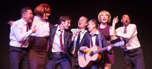 Pictured L to R: Justin Lopez as Greg, SuzyJane Edwards as Dee, Justin Genna* as Peter Allen, John-Thomas Hanson as Mark, John Charles Quimpo as Chris, Grace Chen as Rockie and Kim Larsen as Dick in THE BOY FROM OZ, directed by John Fisher; a Theatre Rhinoceros Production at The Gateway Theatre. Photo by David Wilson.
