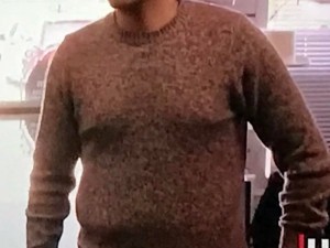 Man Boobs in a brown sweater