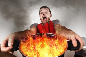 Man Holding Flaming Pot