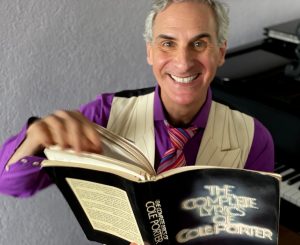 Mark Nadler holding "The Complete Lyrics of Cole Porter"